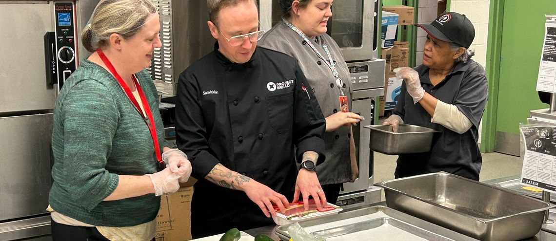 Chef Sam working with Salem school nutrition staff