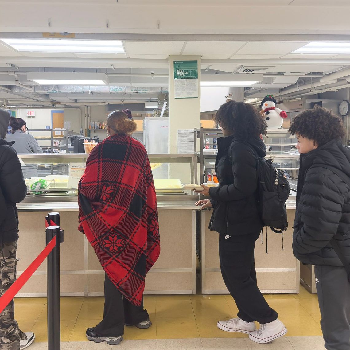 Students line up for a school meal at Avon-Middle High School.