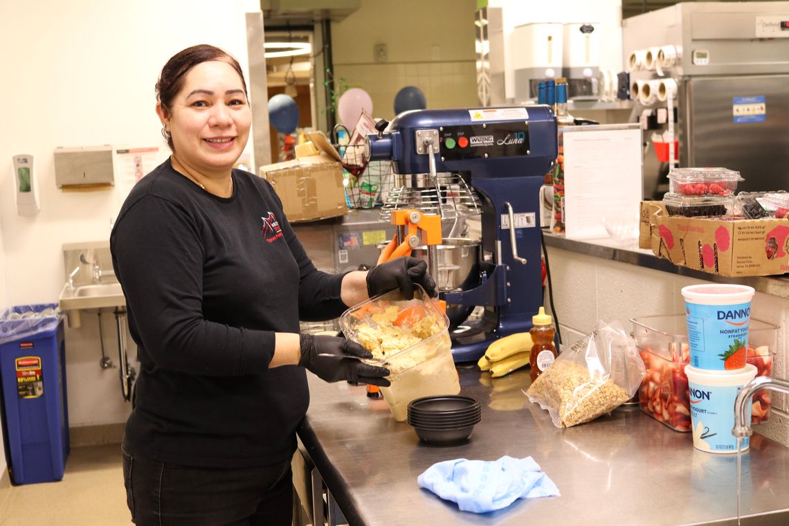 Griselda Velazquez prepares breakfast for students at Clark Avenue Middle School.