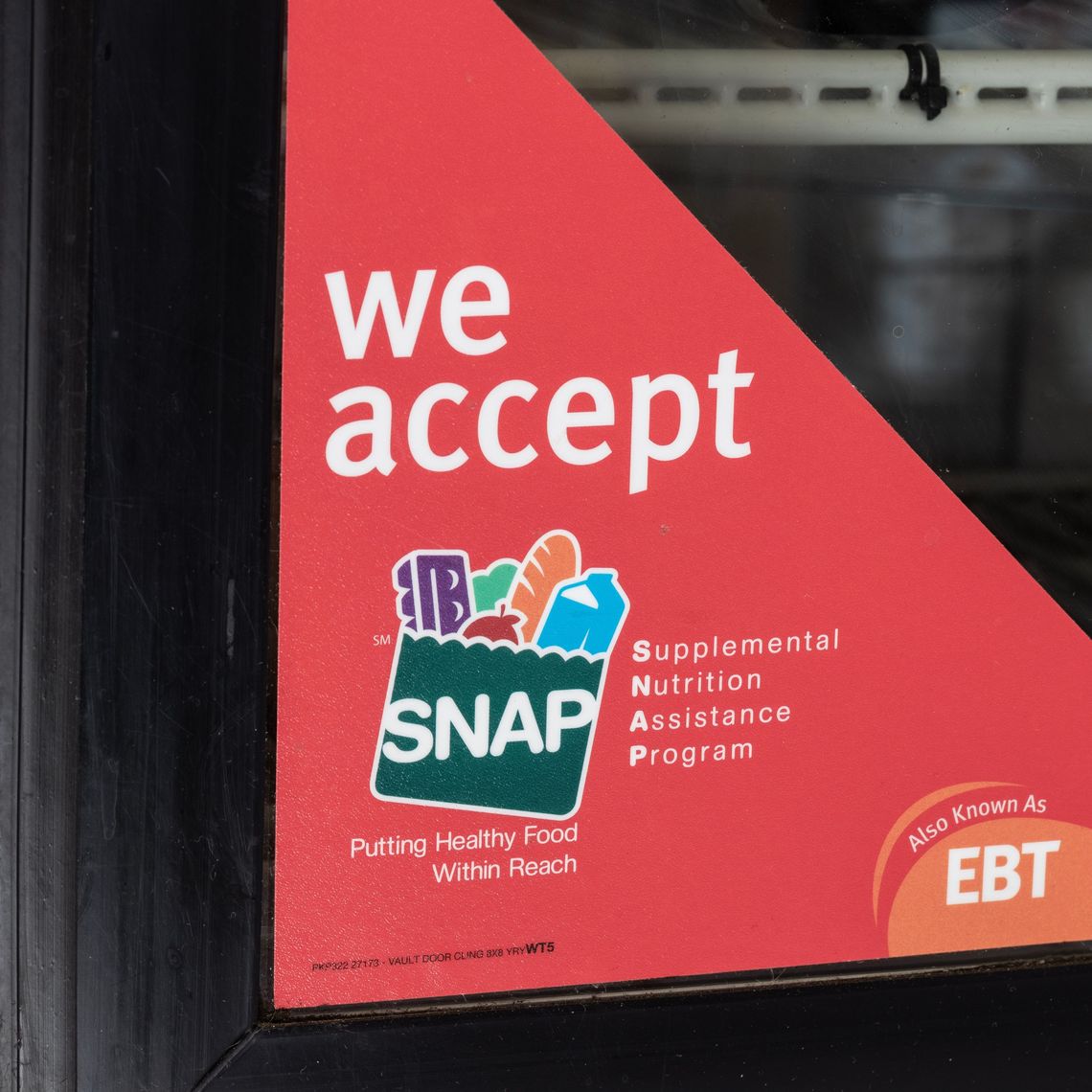 SNAP benefits advertised in a grocery store window