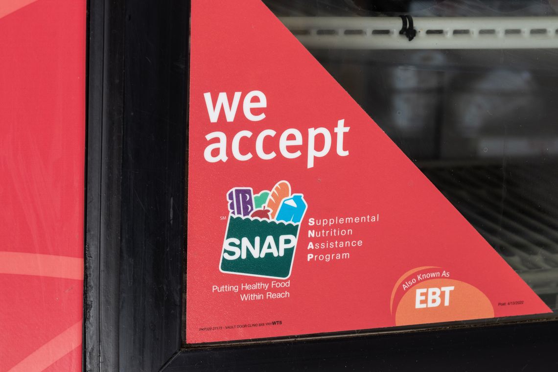 SNAP benefits advertised in a grocery store window