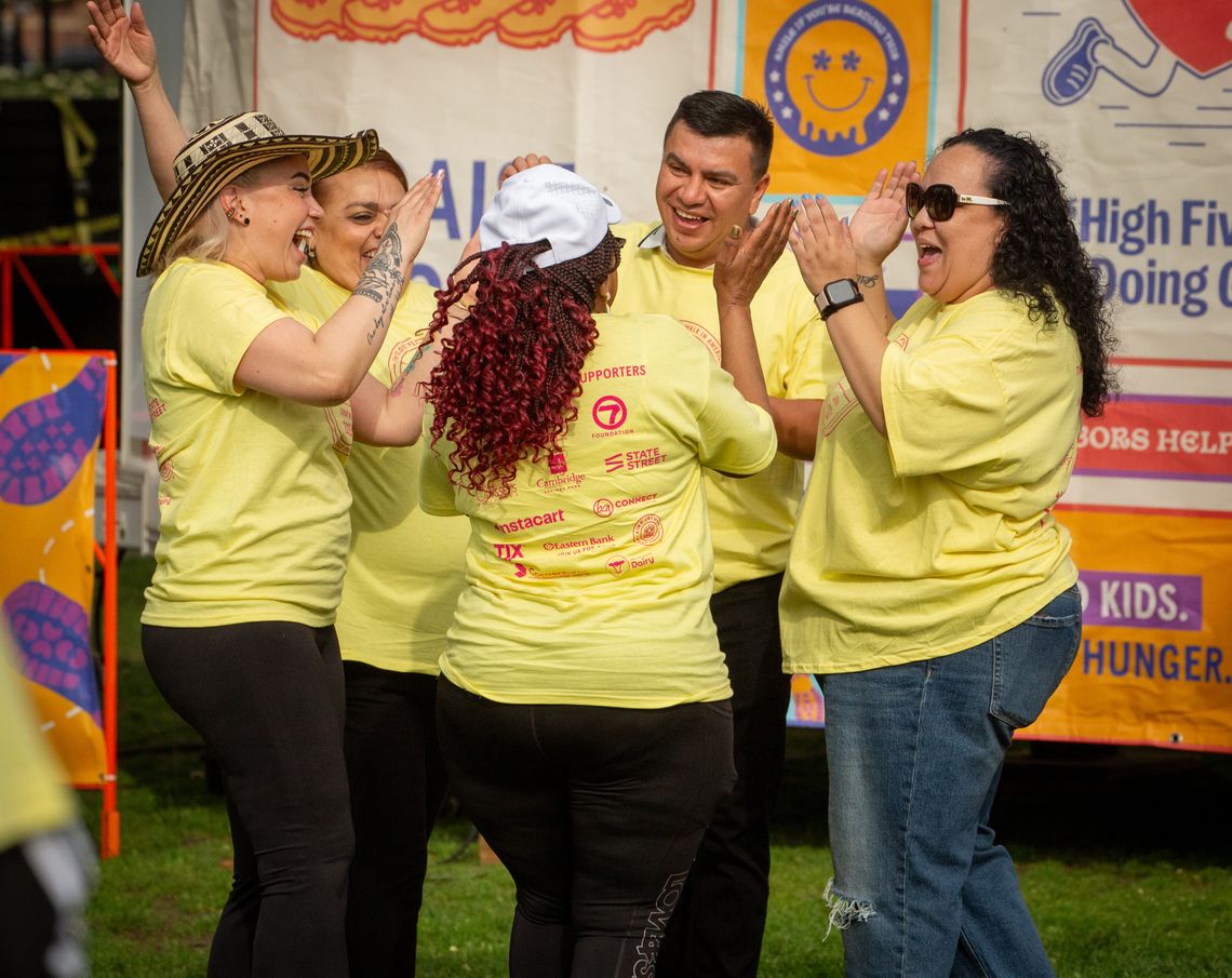 Council of Experts members cheering in a circle