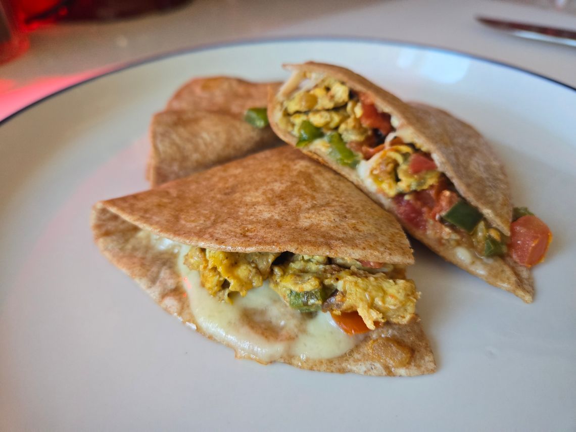 A breakfast quesadilla on a plate