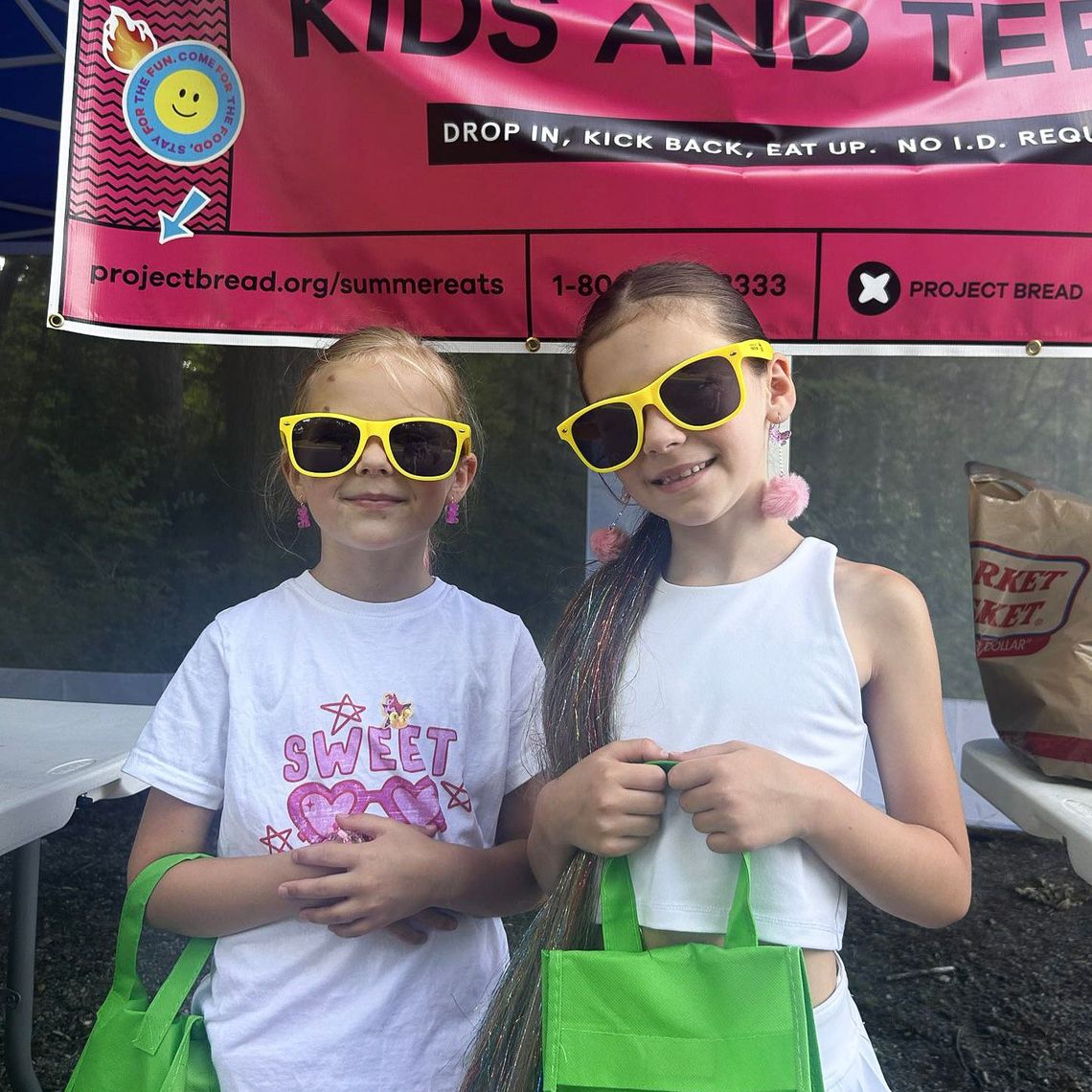 Two kids enjoy Summer Eats in Ipswich.