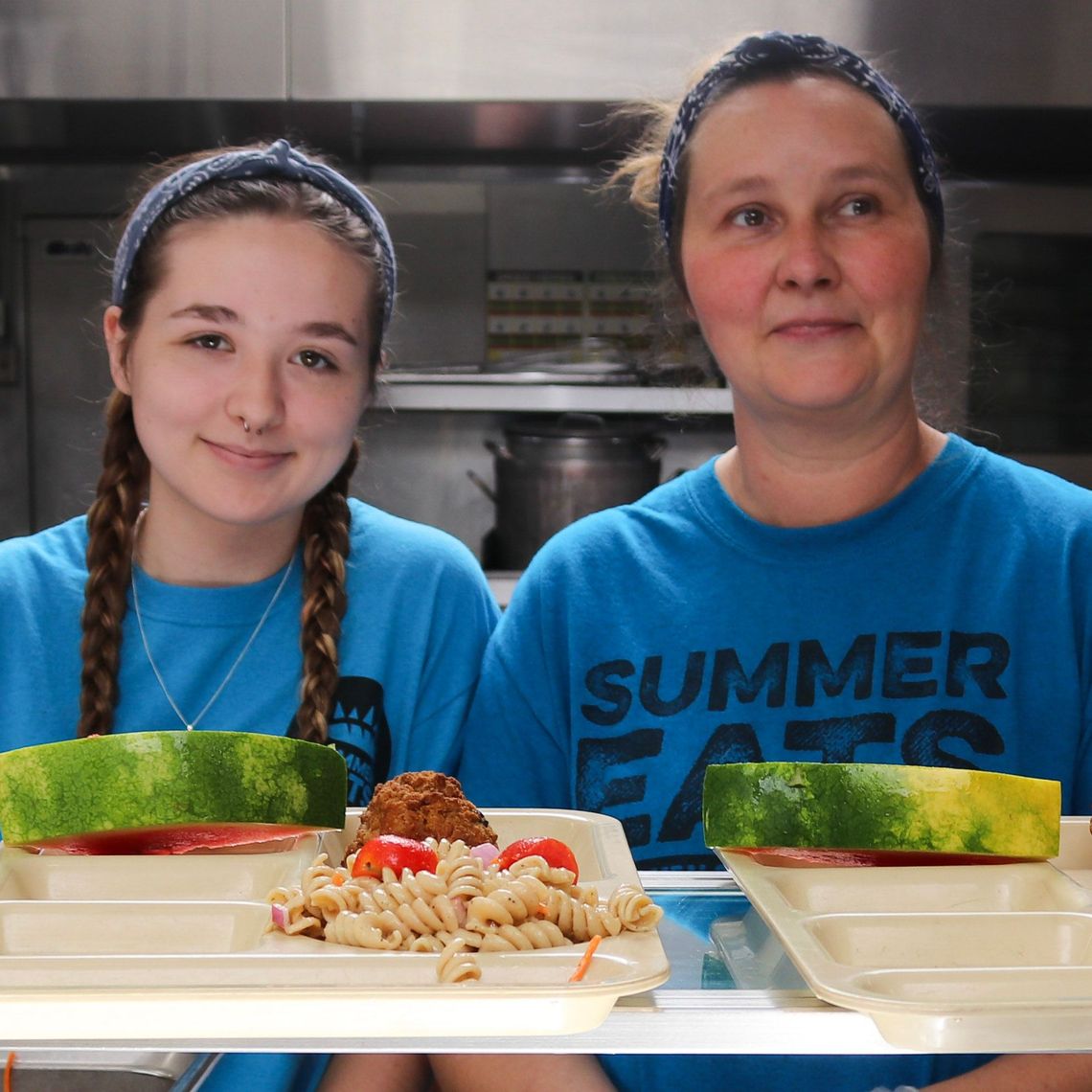 Summer Eats staff serve food in Orange, MA