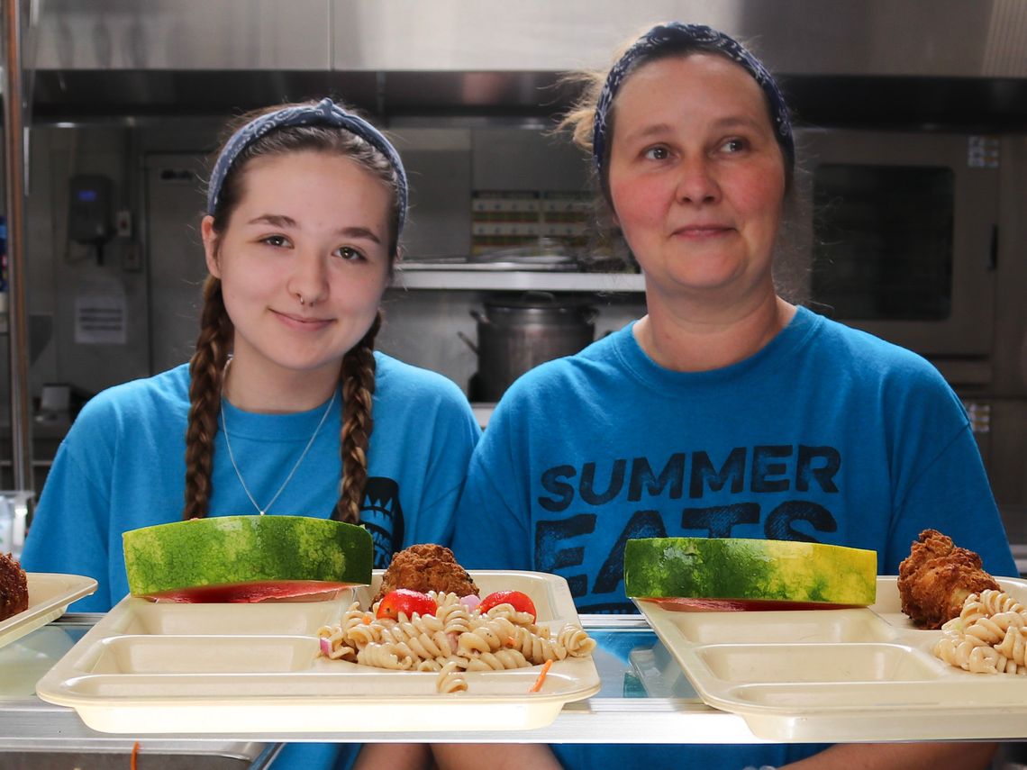 Summer Eats staff serve food in Orange, MA